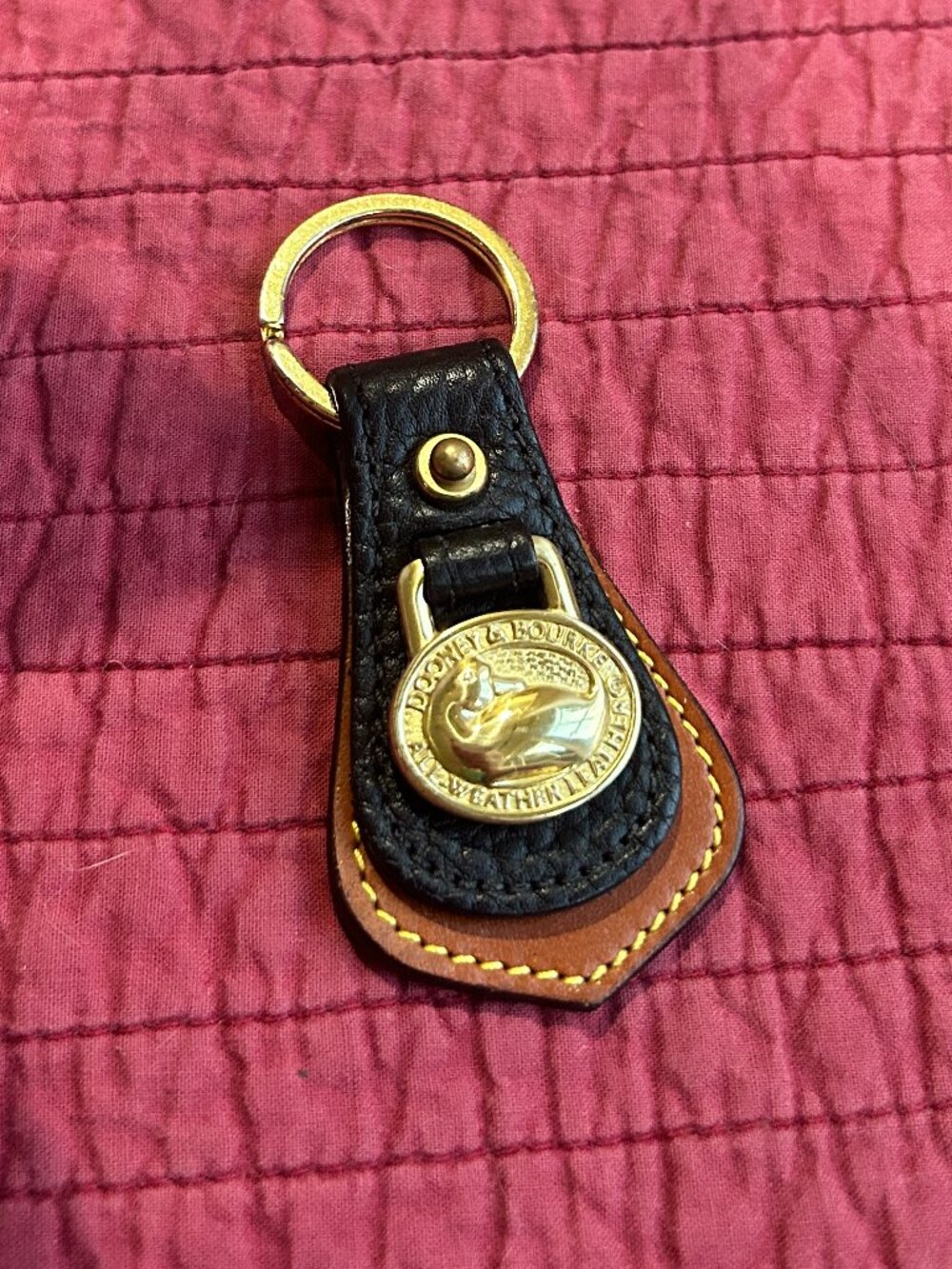 Dooney & Bourke keychain with brown/black leather and gold tone Dooney duck